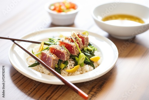 tuna steak seared with sesame seeds and chopsticks