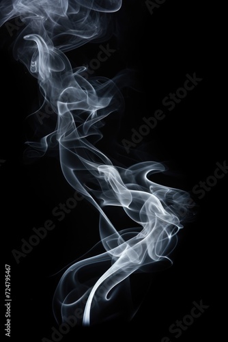 Smoke captured in close-up on a black background. Can be used to depict mystery, atmosphere, or creativity.