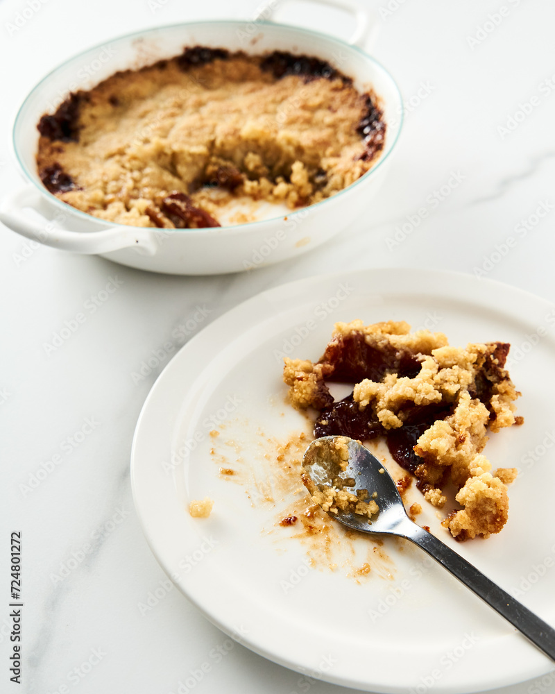 Apple Crumble Pie made from caramelized apples with spices. High-key photo, white marble background. breakfast concept food photo