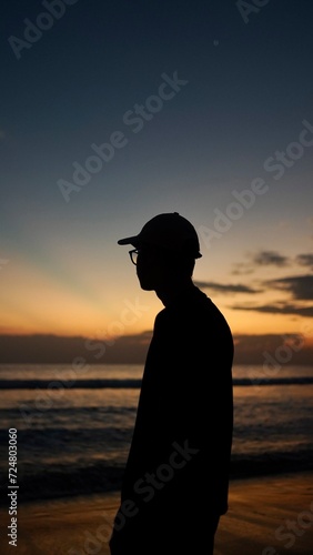 silhouette of a person on the beach at sunset timor leste