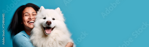 Banner with a portrait of a Woman with a The Samoyed on a blue background