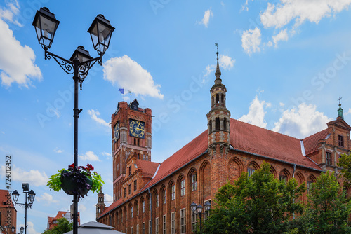 Gothic building of a medieval City Hall in Torun, Poland. Magnificent clock tower. The mediaeval town, birthplace of Nicolaus Copernicus, is listed among the UNESCO World Heritage Sites. Torun, Poland photo