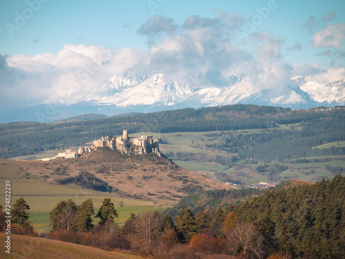 In autumn, the field in the village of Dúbrava offers a beautiful view of the Spiš Castle in the background with the mighty snow-capped peaks of the High Tatras. The largest castle complex in Europe.