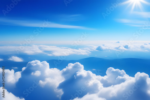 Aerial view of serene blue sky and fluffy clouds, ideal for travel and nature backgrounds.