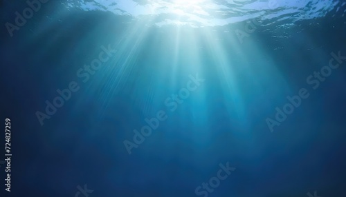 Underwater Ocean Light Rays. A tranquil underwater view with sun rays shining through the water's surface creating a serene pattern of light below © Juri_Tichonow