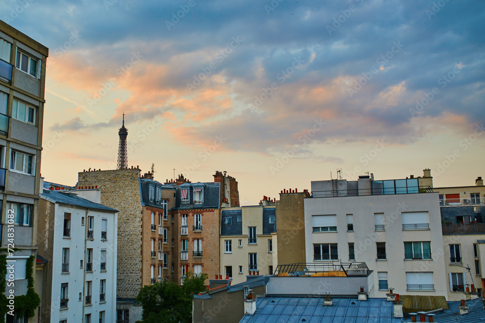 Parisian skyline with the Eiffel tower with dramatic colorful sunset