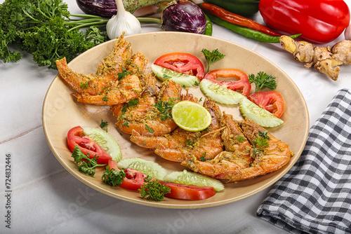 Grilled prawn served lime and vegetables