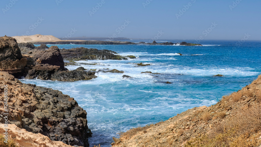 Rugged coast of Boa Vista tropical island : rocks and ocean waves. Cape Verde	