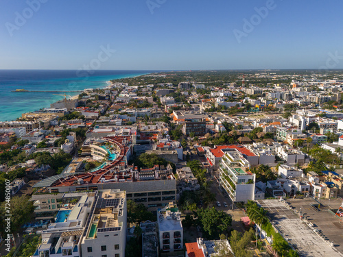 Aerial drone view of downtown area in Playa del Carmen with blue Caribbean Sea and cloudless blue sky in the morning 