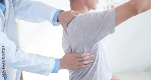 Doctor or Physiotherapist working examining treating. Physiotherapy, chiropractor and healthcare rehabilitation support of man