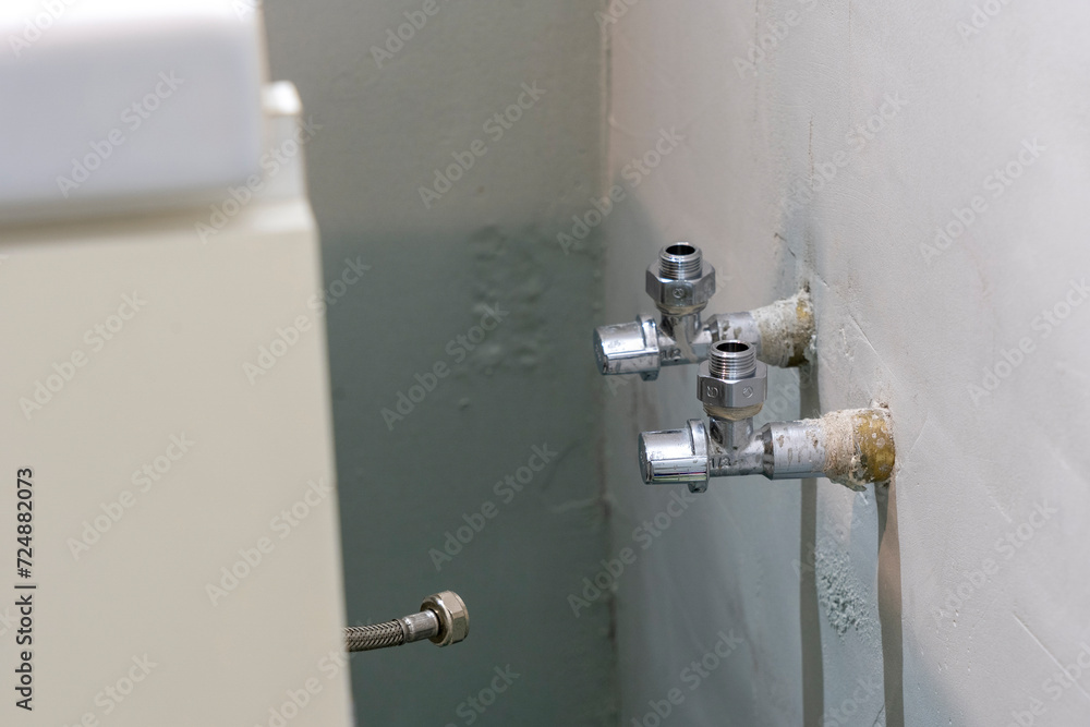 Adapters Twisted: Water Tap Threads Upgraded in a Bathroom Plumbing Transformation.