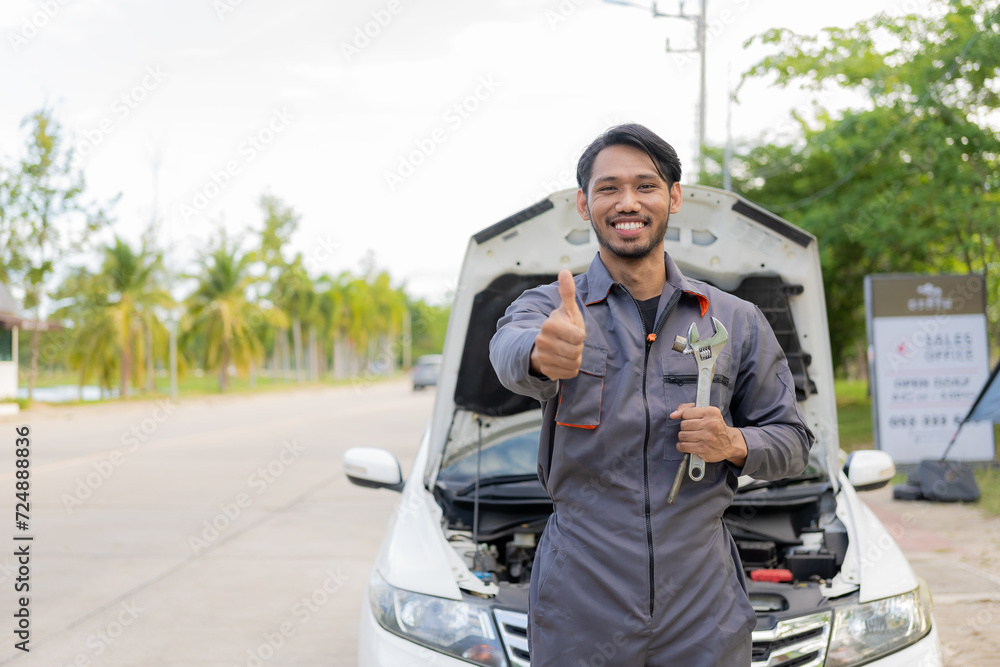 maintenance concept Asian auto mechanic or smith writing on clipboard at warehouse workshop Technician making checklist for car repair Roadside breakdown and insurance concept maintenance concept Asian auto mechanic or smith writing on clipboard at warehouse workshop Technician making checklist for car repair Roadside breakdown and insurance concept