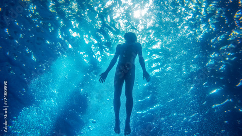 Man Snorkeling in Clear Tropical Waters. Male swimmer explores the underwater world in clear water © Svetlana Kolpakova