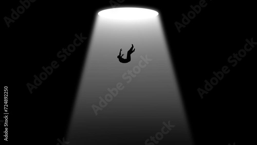 Light Hole with Man Failing Deep Down in The Darkness. Lonely Person Floating in dark Empty Space (Void). Dramatic Scene. Depression and Loneliness. Surrealism and phobia imagination  photo