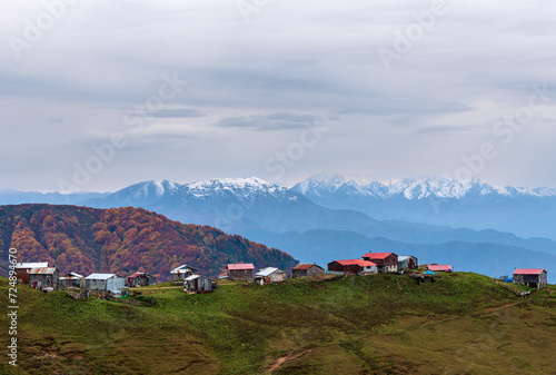 Plateau houses and snowy mountains
