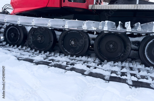 Snowcat machine for snow removal. Preparation ski trails. Snow groomer. Snowy tracks of snowcat in the mountains. Ratrac snowcat. Snow tucker photo