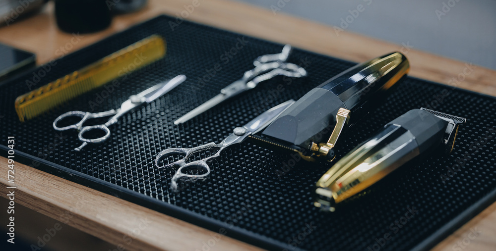 Barbershop background for men beauty salon, hairdresser tools scissors and comb, blue toning color Barbershop background for men beauty salon, hairdresser tools scissors and comb, blue toning color