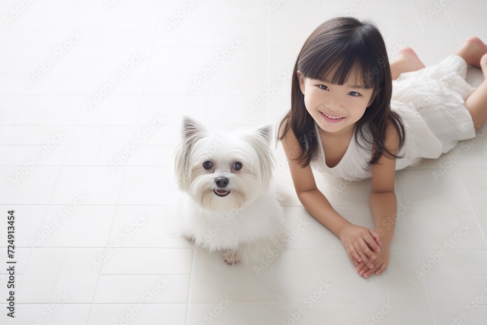 A cute girl posing with her little dog. a light photo. the concept of friendship with a pet A cute girl posing with her little dog. a light photo. the concept of friendship with a pet