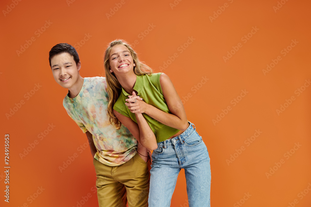 cheerful diverse teenage friends in vibrant attires having fun and smiling at camera, friendship day cheerful diverse teenage friends in vibrant attires having fun and smiling at camera, friendship day