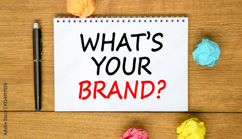 Fototapeta premium Branding what is your brand symbol. Concept words What is your brand on beautiful white note. Beautiful wooden background. Black pen. Paper. Business branding what is your brand concept. Copy space.