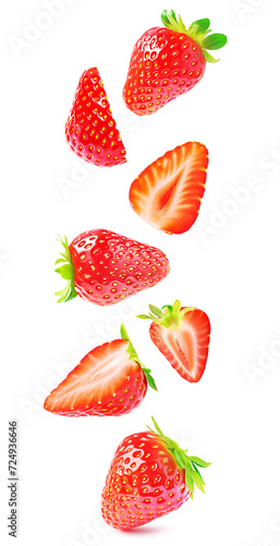Cut fresh strawberries with slices flying isolated against white background