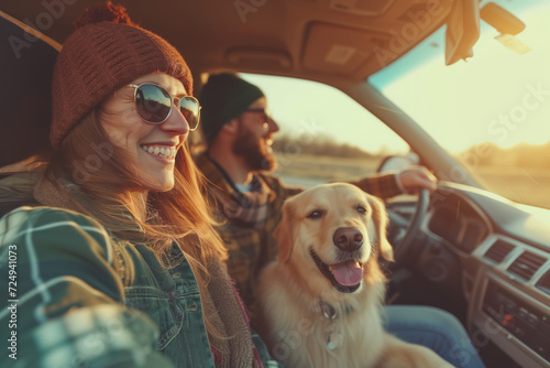 Couple of travelers and their dog going on a trip by a car. Adventurous young people with a pet. Hiking and trekking on a nature trail.