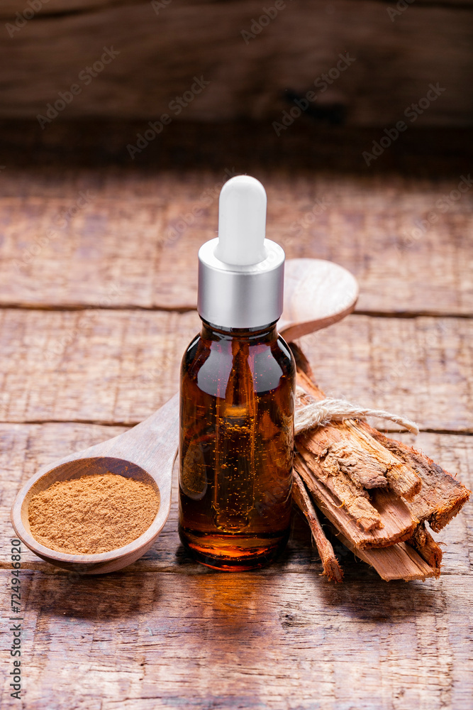 Splinters, powder and essence of cinnamon, on the old table Splinters, powder and essence of cinnamon, on the old table