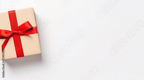 gift box with red ribbon bow on white background