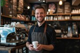 Male coffee shop business owner stands proudly happy in a cozy coffee shop. Small business owner.