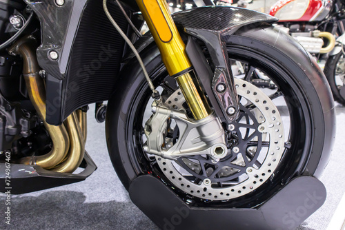 Disc brakes on a motorcycle up close alloy wheels for motorcycles robust steel wheel arches. Tires and wheels for motorcycles in chrome. ABS on motorbikes and disc brakes are safety devices.