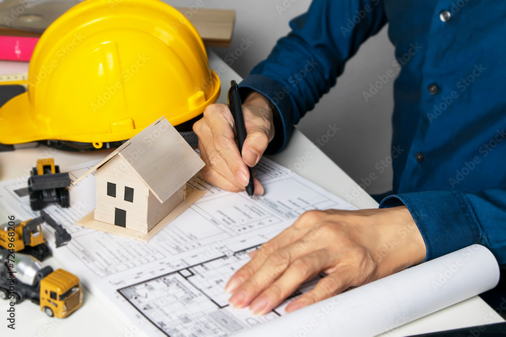 Engineers sit and work on building design and system work.,construction work safety,construction business and real estate Engineers sit and work on building design and system work.,construction work safety,construction business and real estate