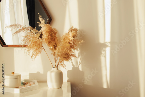 Фототапет Light and airy modern interior, with decorative pampass grass in a vase in a sun