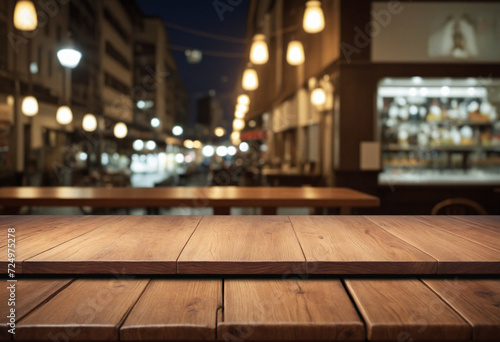 Rustic wooden tabletop for product displays with blurred night party backdrop
