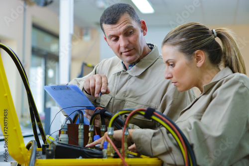 technicians working in factory hall © auremar