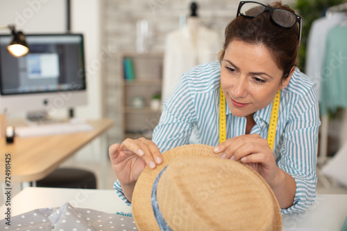 Canvas Print hat maker working on design in studio