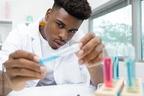 lab technician working with pipette in molecular laboratory photo