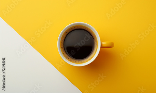 Cup of coffee on a bright yellow background. A hot morning invigorating drink. Place for text. Copy space. photo