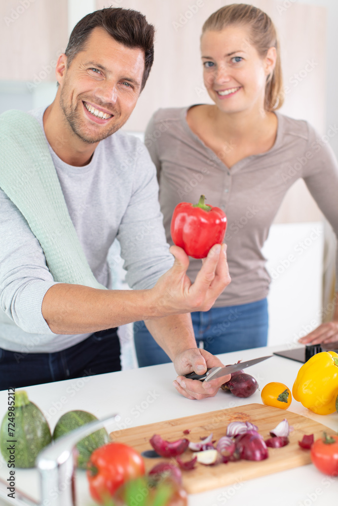 handsome man with woman in the kitchen handsome man with woman in the kitchen