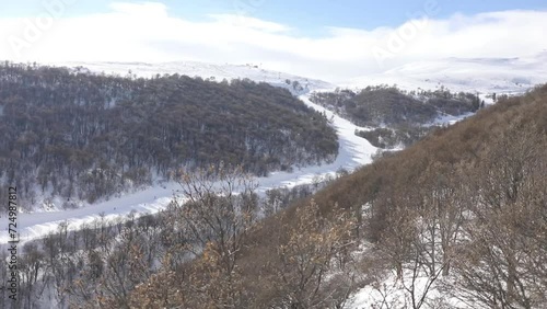 Tree-covered hills and a ski slope in Tsaghkadzor, Armenia photo