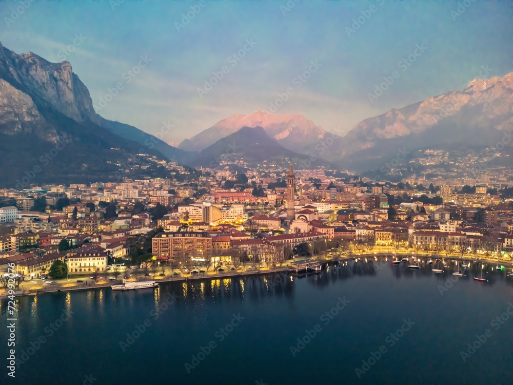 Drone shot of the city of Lecco and Lake Como, Italy. Mount Resegone in the background