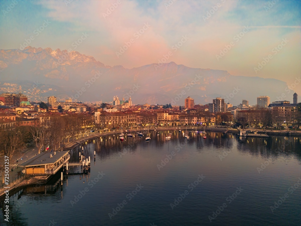 Drone shot of the city of Lecco, Italy. Mount Resegone in the background