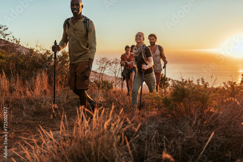 Diverse group of young people hiking together in south africa photo