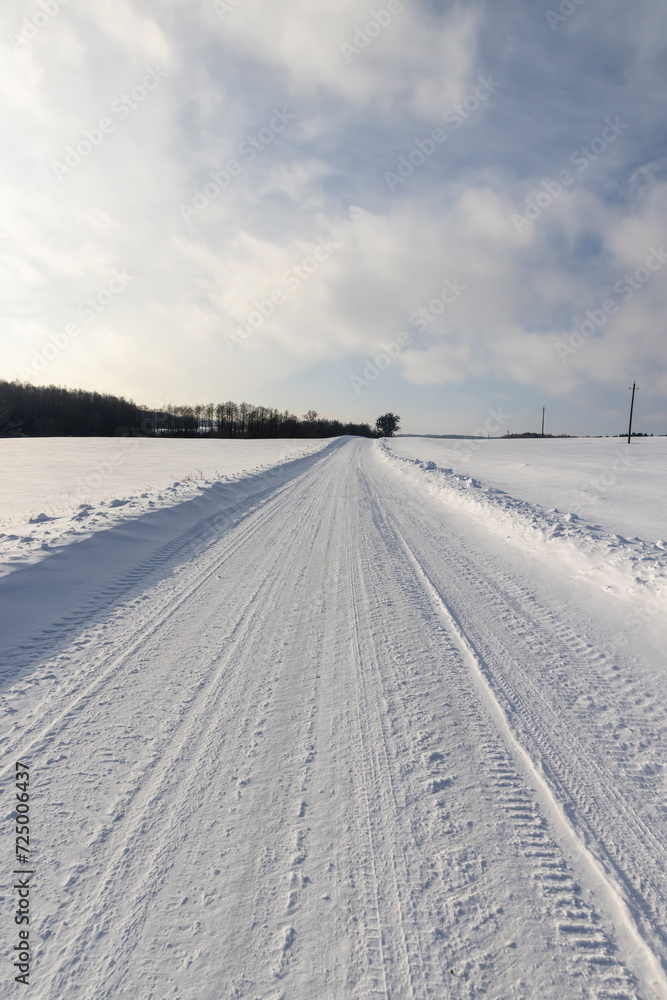 winter road after snowfall in sunny weather