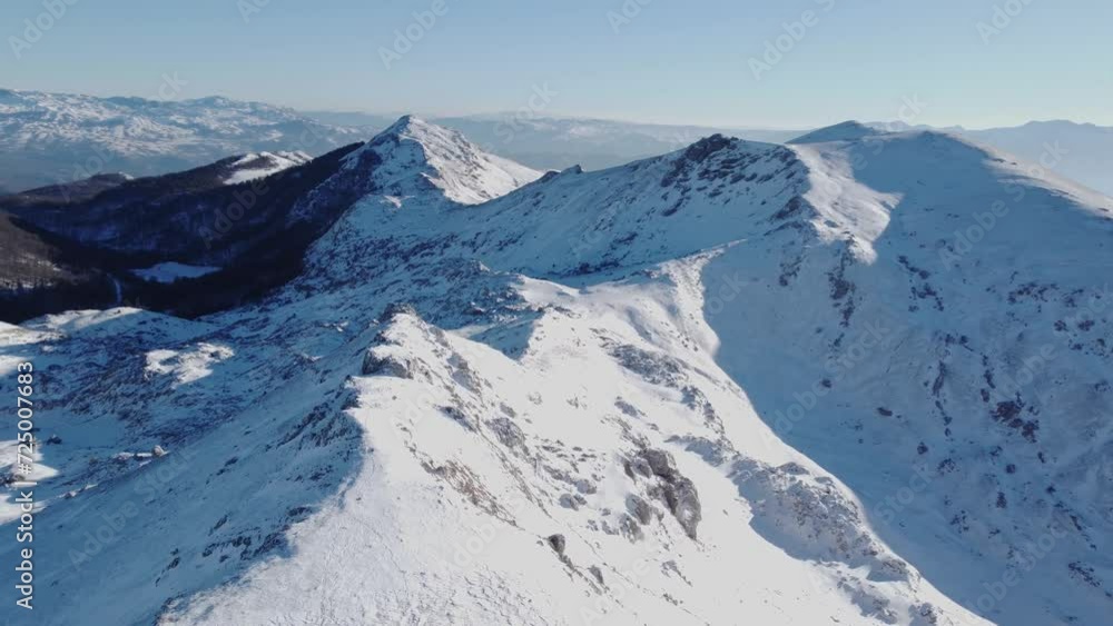 aptivating aerial views of snow-kissed mountain peaks, a winter wonderland unfolds with pristine landscapes, serene valleys. aptivating aerial views of snow-kissed mountain peaks, a winter wonderland unfolds with pristine landscapes, serene valleys.