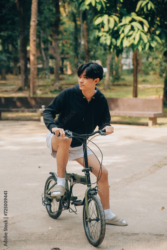 Handsome happy young man with bicycle on a city street, Active lifestyle, people concept Handsome happy young man with bicycle on a city street, Active lifestyle, people concept