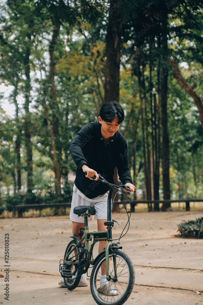Handsome happy young man with bicycle on a city street, Active lifestyle, people concept