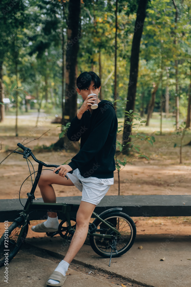 Handsome happy young man with bicycle on a city street, Active lifestyle, people concept Handsome happy young man with bicycle on a city street, Active lifestyle, people concept