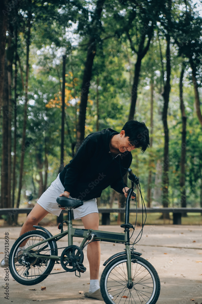 Handsome happy young man with bicycle on a city street, Active lifestyle, people concept