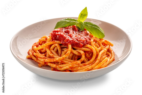 Bucatini pasta with tomato sauce and basil leaves in white plate isolated