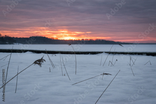 Beautiful sunrise over the frozen lake